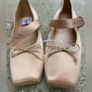 Mango Satin Loafers with Strap in peach.